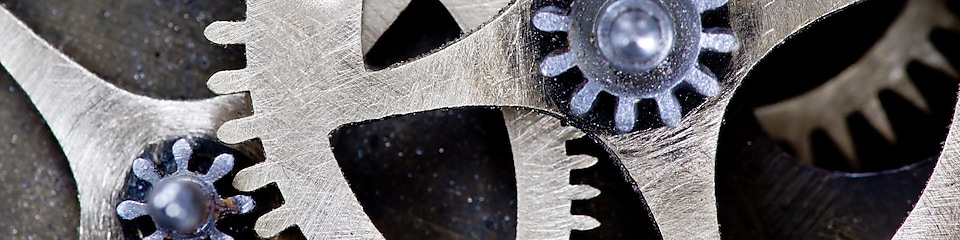 Macro photo of tooth wheel mechanism with ADAPTABILITY concept words