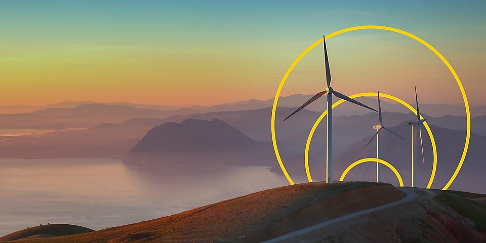Photo de trois éoliennes sur une colline avec le contour du graphisme Atteindre le zéro émissions nettes
