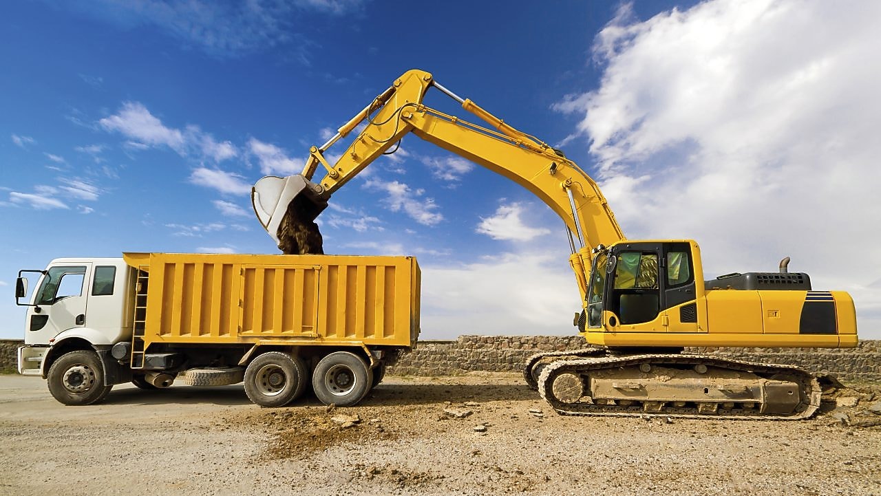 Excavator loading dumper truck