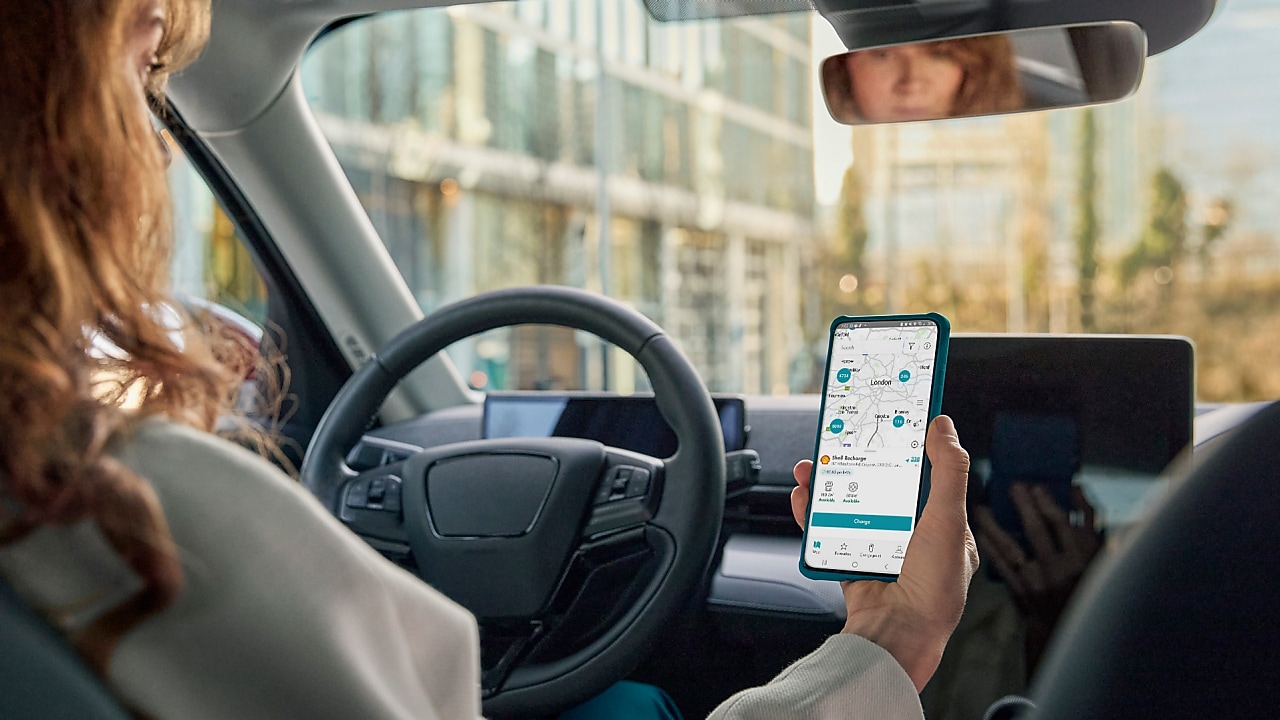 woman consulting the shell recharge app