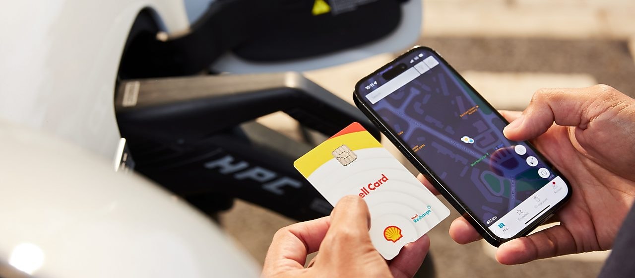 Shell Card and man using phone 