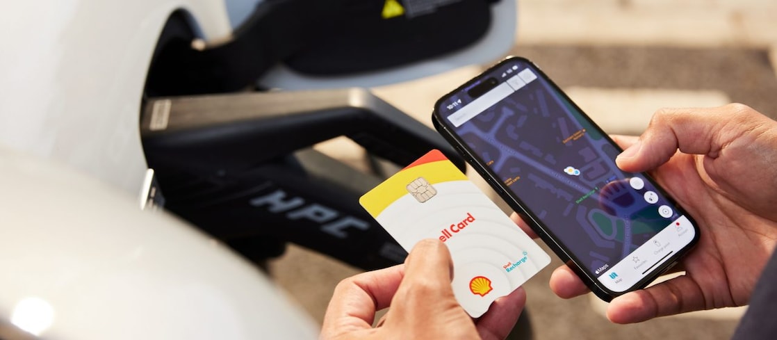 Shell Card and man using phone 