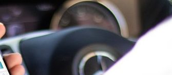 Man using phone in car