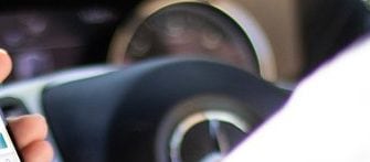 Man using phone in car
