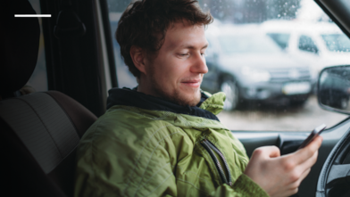 Man using mobile in car
