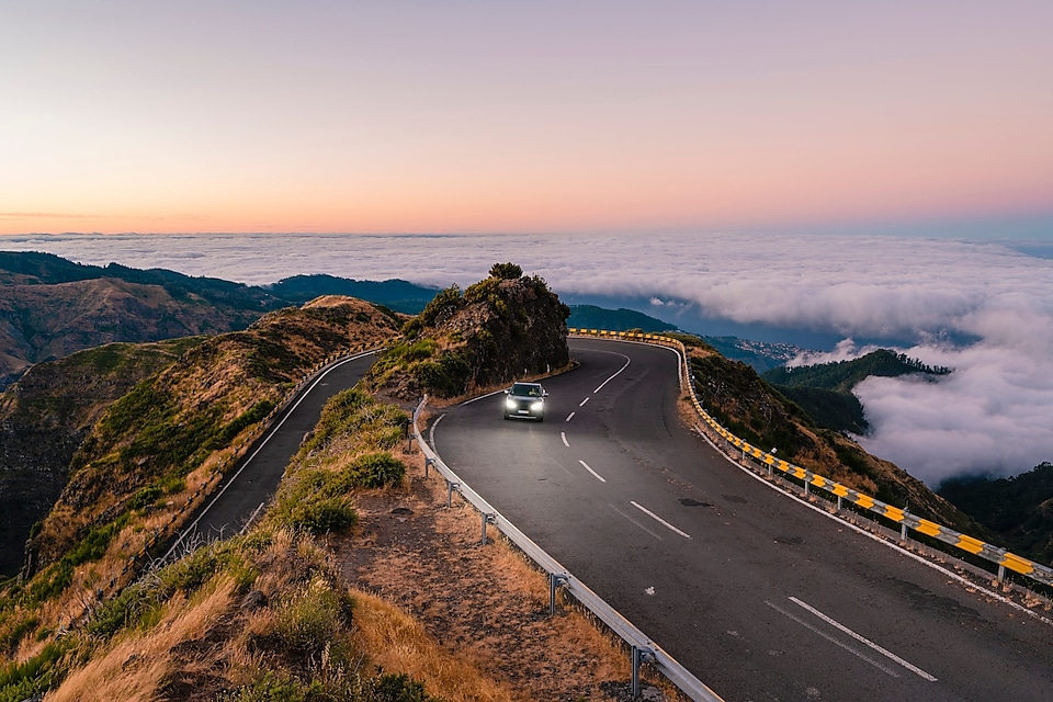 car-driving-on-winding-mountain-road-one