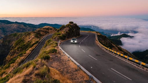 car-driving-on-winding-mountain-road-one