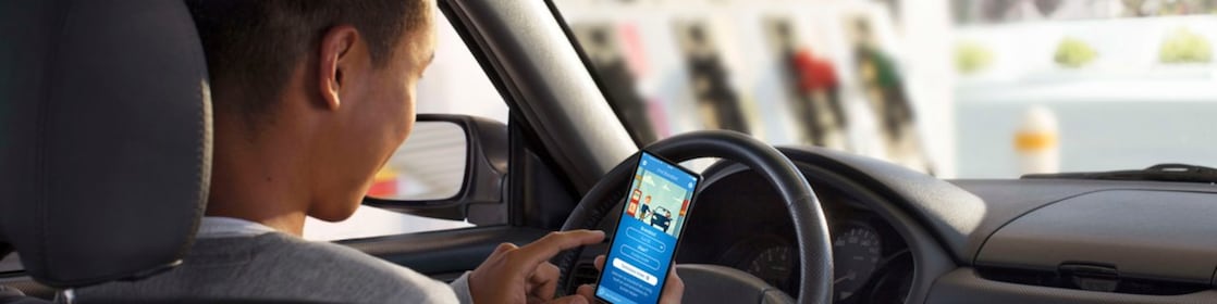 Man in car with phone